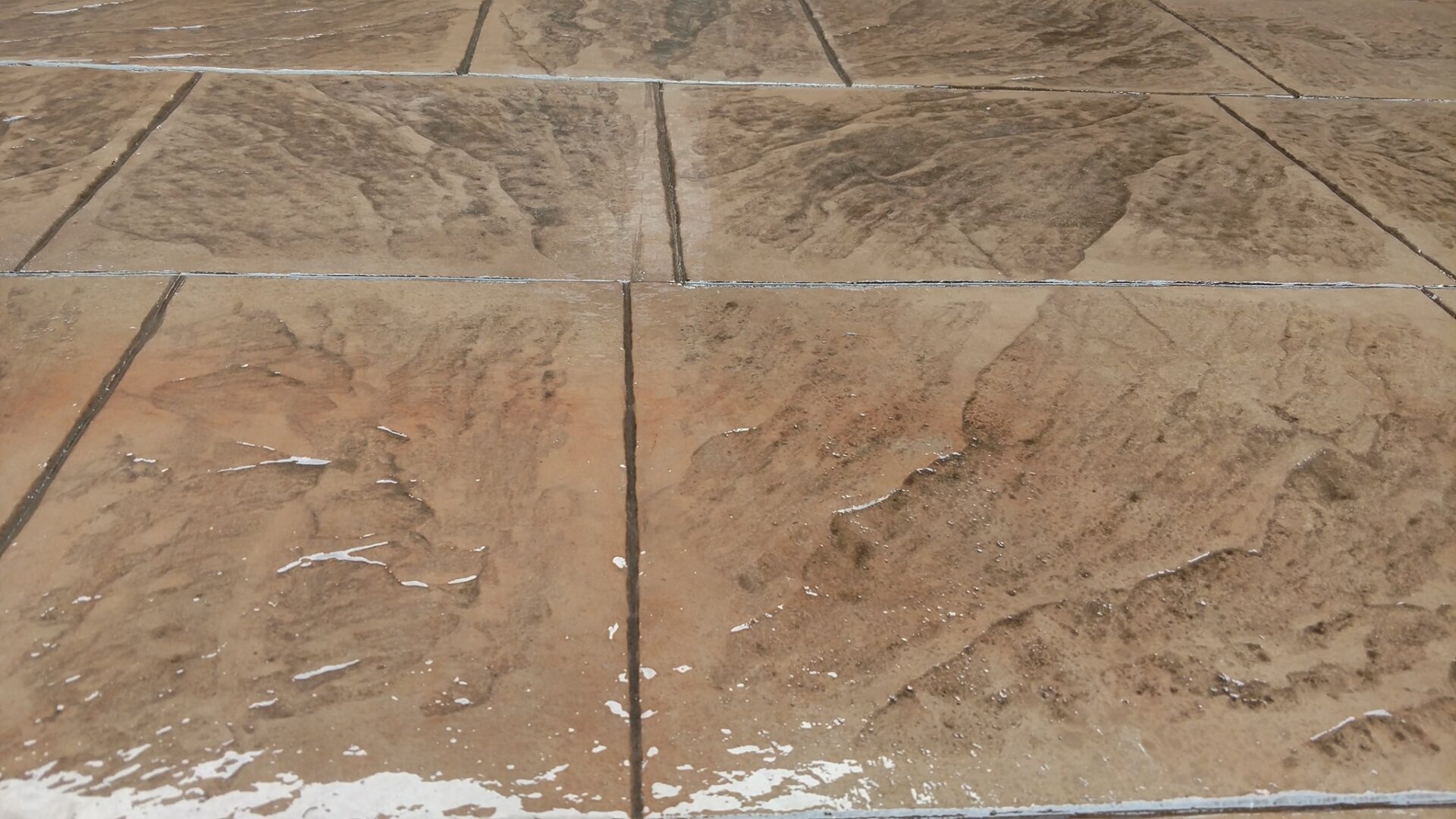 A close up of the floor tiles with cracks
